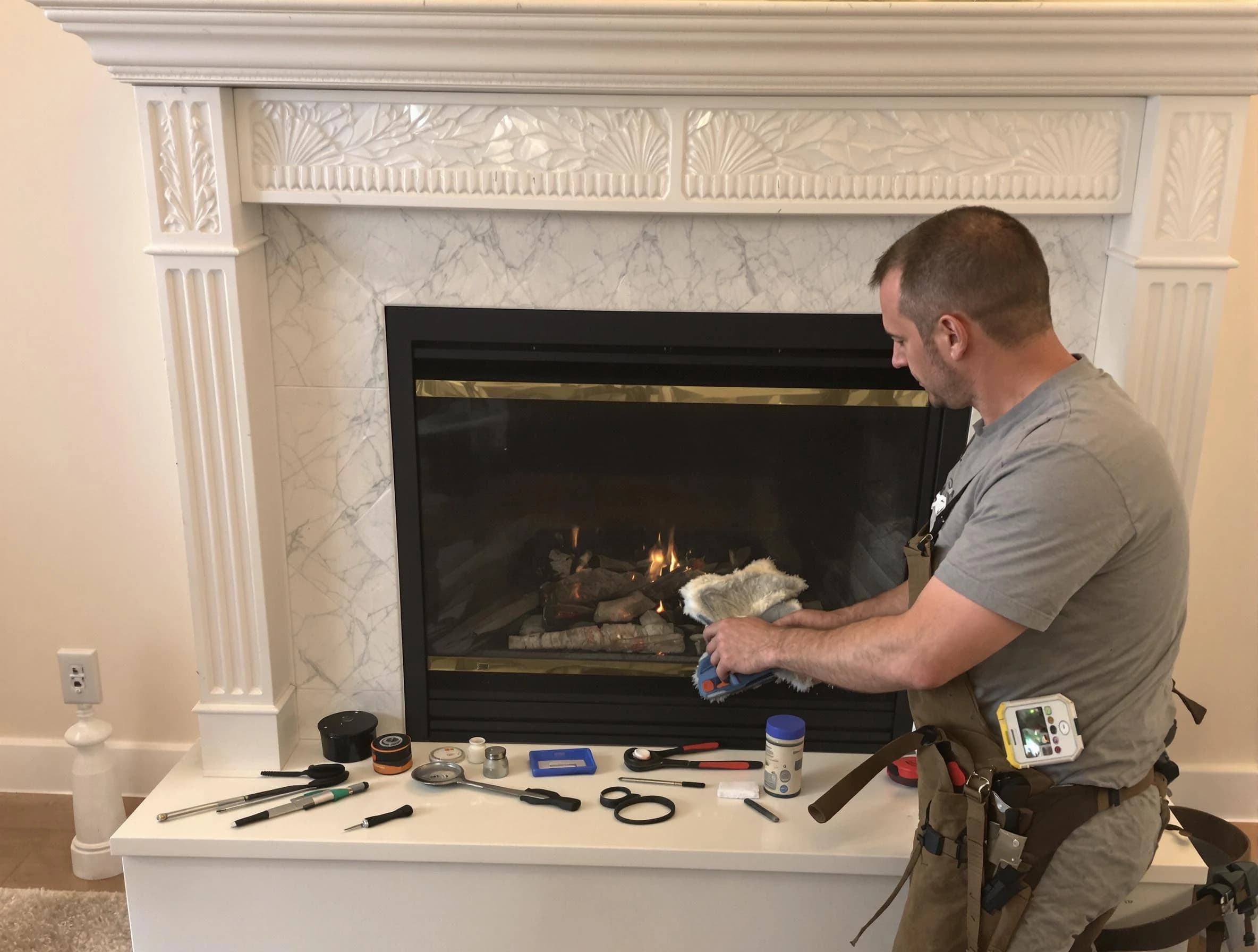 Wellesley Chimney Sweep performing fireplace maintenance in Wellesley, MA