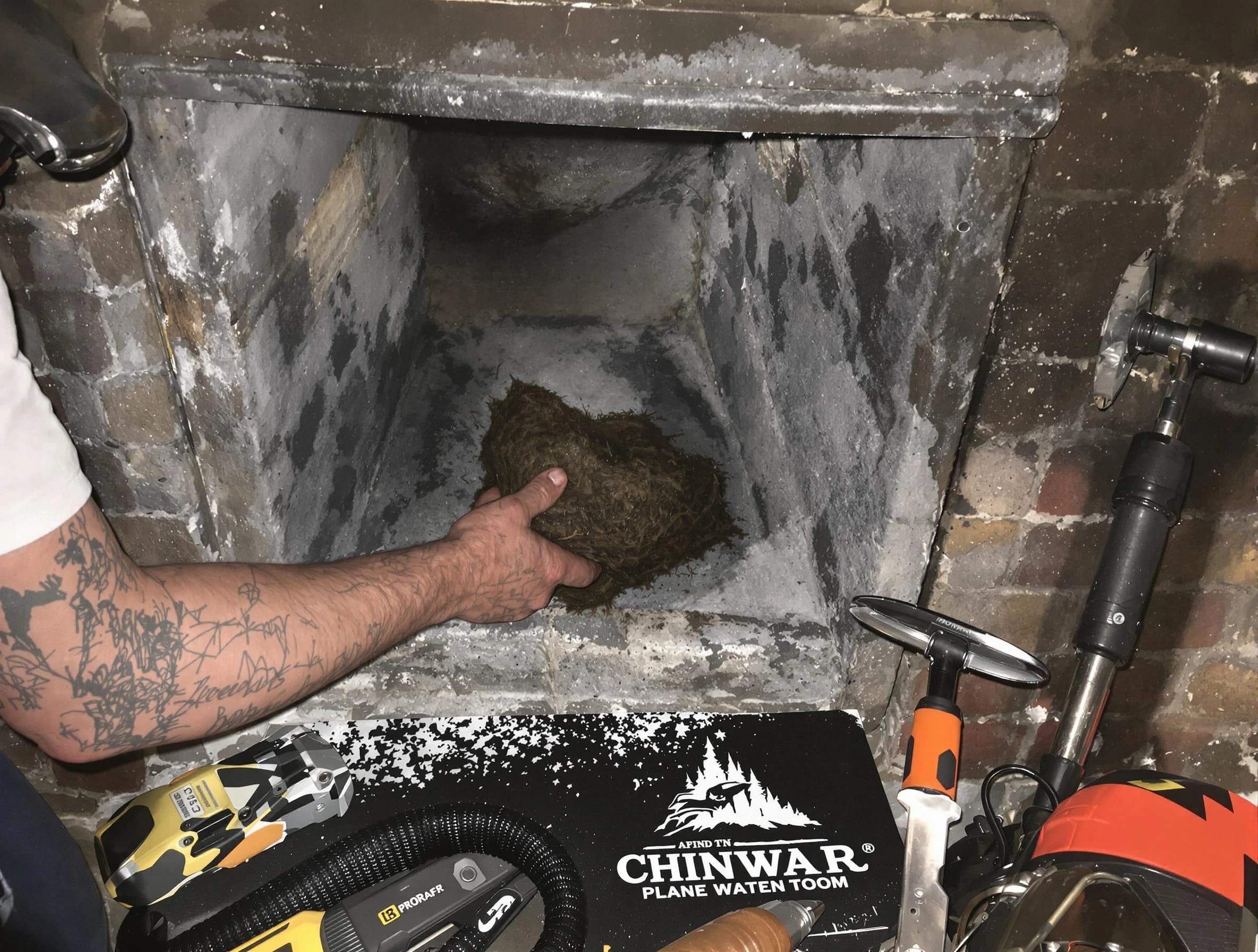 Wellesley Chimney Sweep safely removing debris and screening chimney in Wellesley, MA